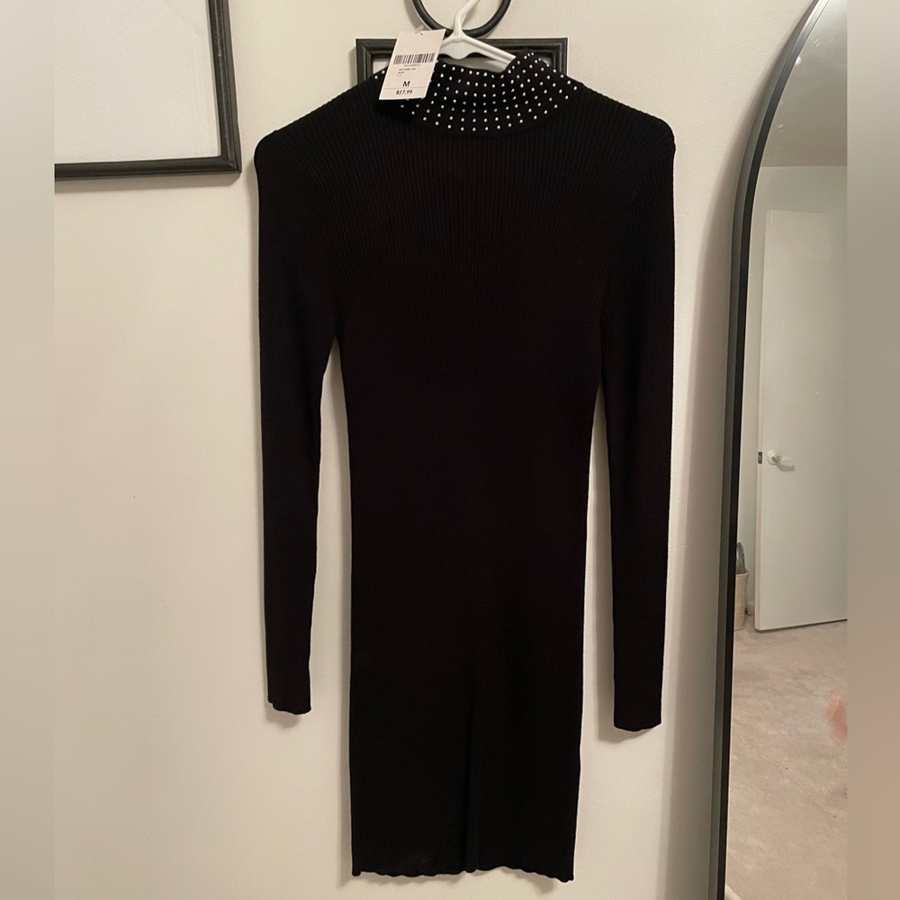 Black mock neck sweater dress with silver rhinestones